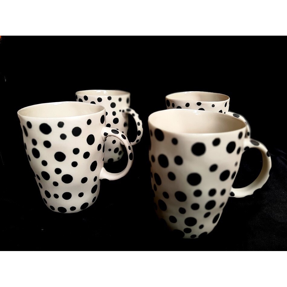 Tea cup with distorted shape with polka dots made at Authentic Bat Trang