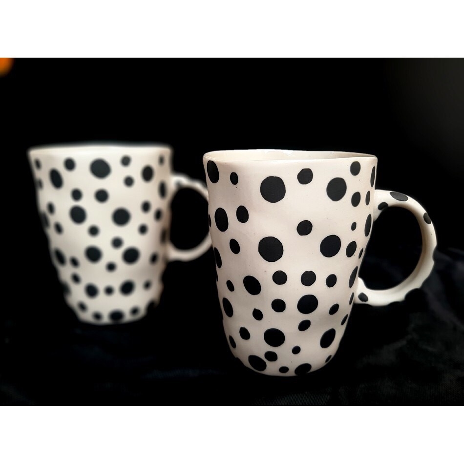 Tea cup with distorted shape with polka dots made at Authentic Bat Trang