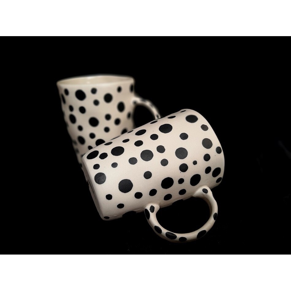 Tea cup with distorted shape with polka dots made at Authentic Bat Trang